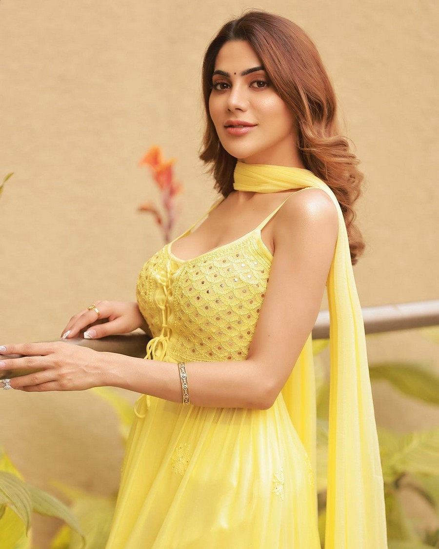 Glamorous Stills Of Nikki Tamboli in Yellow Dress