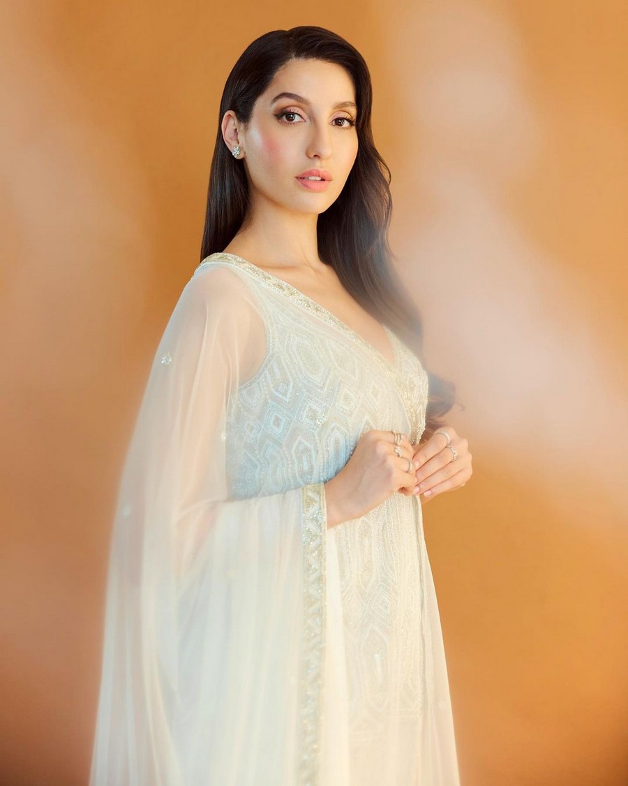 Trendy Stills Of Nora Fatehi in White Dress