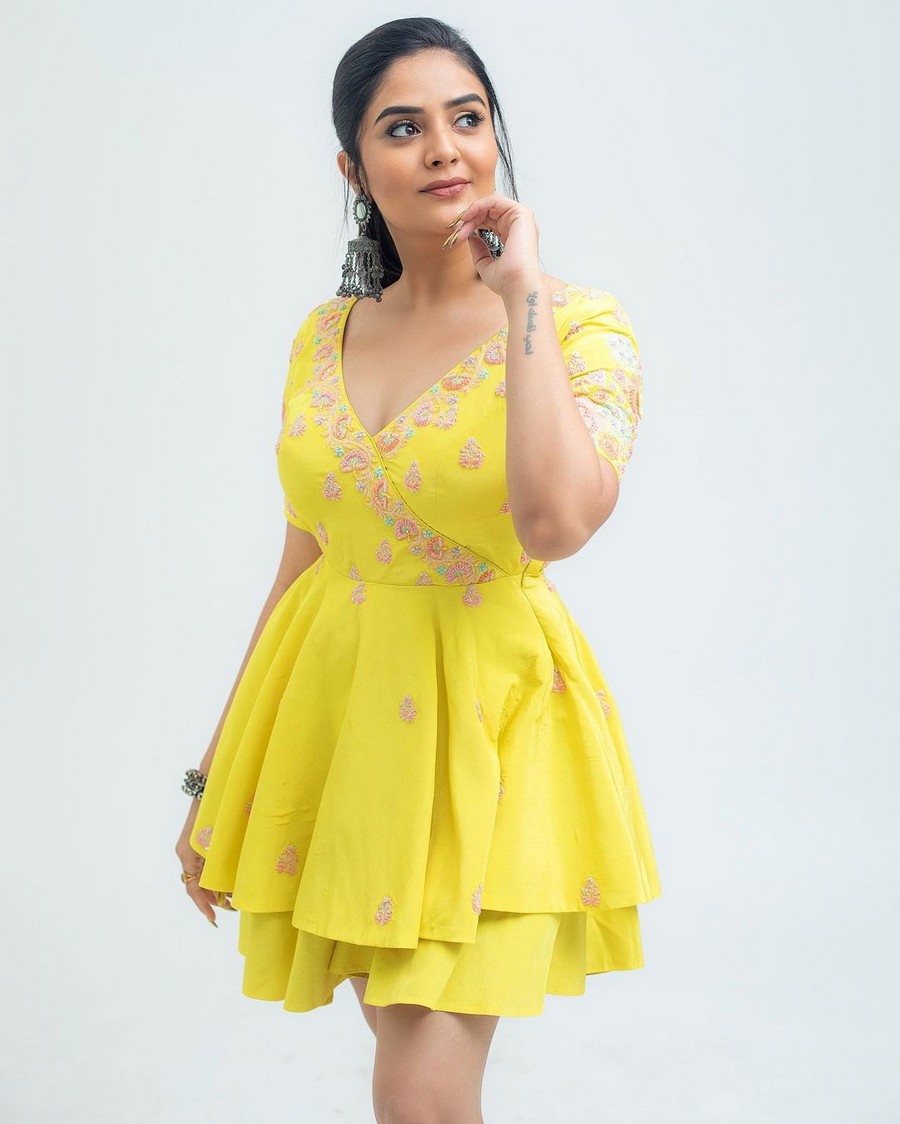 Sreemukhi Alluring Poses in Yellow Outfit