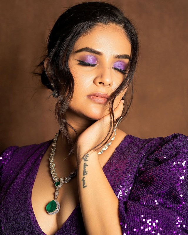 Sreemukhi Looking Sexy in Shiny Violet Dress
